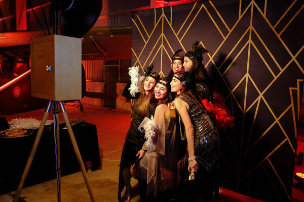 Great Gatsby party Photo Booth roaring 1920's guests posing in the vintage Photo Booth.