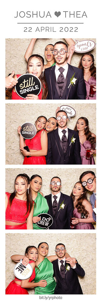 photo booth photo strip with flower wall and guests posing with wedding signs