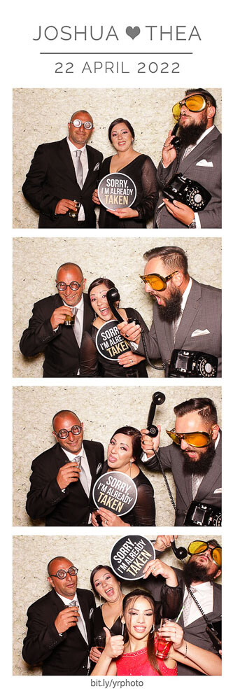 photo booth photo strip with flower wall and guests posing with antique phone