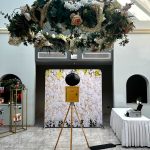 A gorgeous vintage photo booth set up in the hall at Xara Lodge