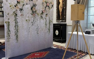 Arrigo-wedding-photo-booth A photo booth in front of a backdrop.