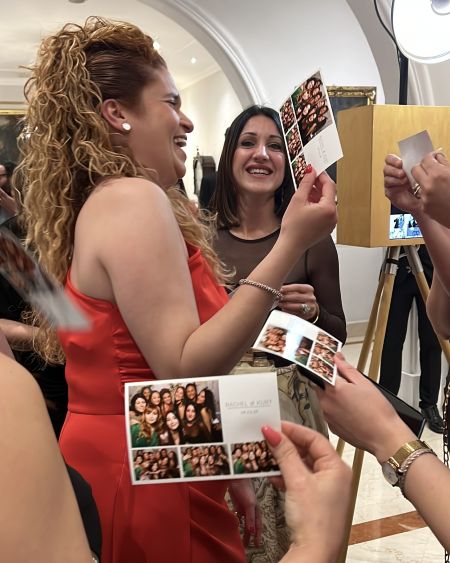 Arrigo-wedding-woman-laughing woman looking at their photo prints