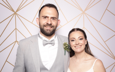 jeremy-and-luisa-wedding-hero-image Hero image of newlyweds Jeremy and Luisa taking a photo on their wedding day.