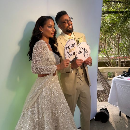 leanne-manraaj-wedding-couple-razett-labjad-malta The bride Leanne and groom Manraaj smiling together during their destination wedding ceremony at Razett L’Abjad in Malta.