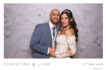 wedding-couple-snapshot-booth-session hristina and Liam sharing a fun, candid moment inside the Snapshot photo booth during their reception.