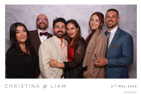 packed-photo-booth-wedding-reception The high-energy atmosphere as a group of guests crowd into the photo booth.