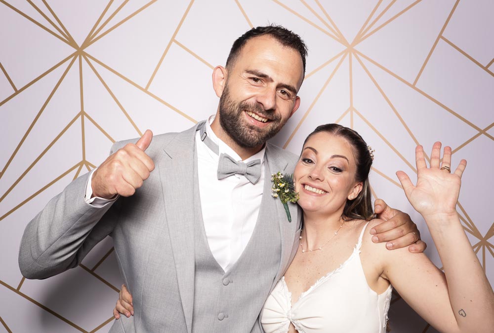 wedding-photo-booth-malta-bride-and-groom-photo-booth-moments Bride and groom posing in front of a photo booth.
