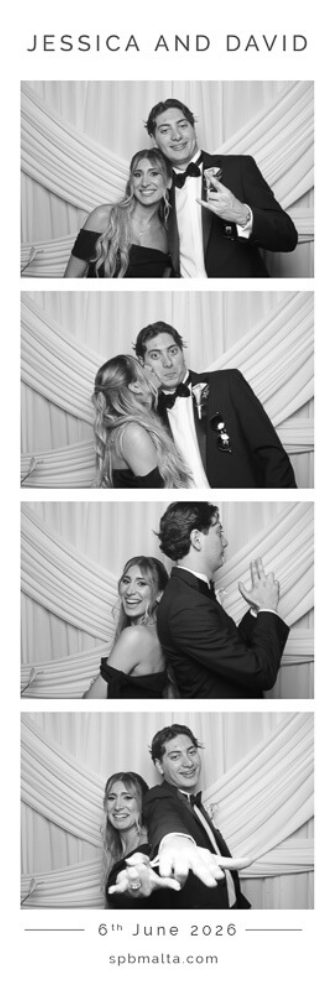 jessica & david-02 Happy couple sharing a sweet moment against a white fabric backdrop in a custom wedding photo booth at The Phoenicia Hotel Malta.