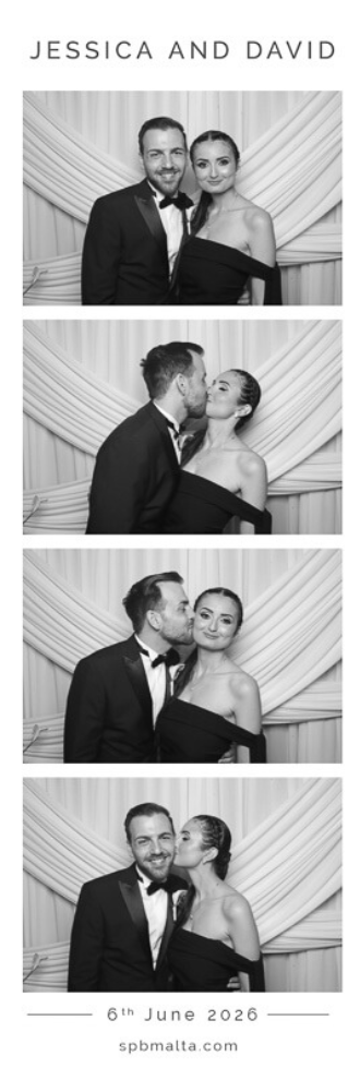 jessica & david-06 A romantic couple smiling for a black and white photo booth print in front of a draped white background at a luxury Malta wedding.