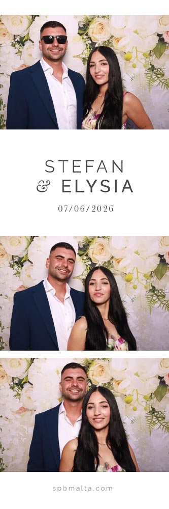 wedding-photo-booth-malta-couple-photo-strip-3 A wedding guest couple smiling and posing together in a photo booth in front of a floral backdrop.