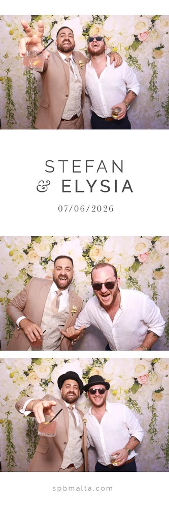 wedding-photo-booth-malta-groom-and-friend-photo-strip The groom Stefan and a friend wearing hats and sunglasses posing in front of a white and pink floral backdrop.