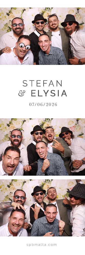 wedding-photo-booth-malta-group-of-friends-photo-strip-1 A group of six wedding guests smiling and posing together in front of a floral backdrop.